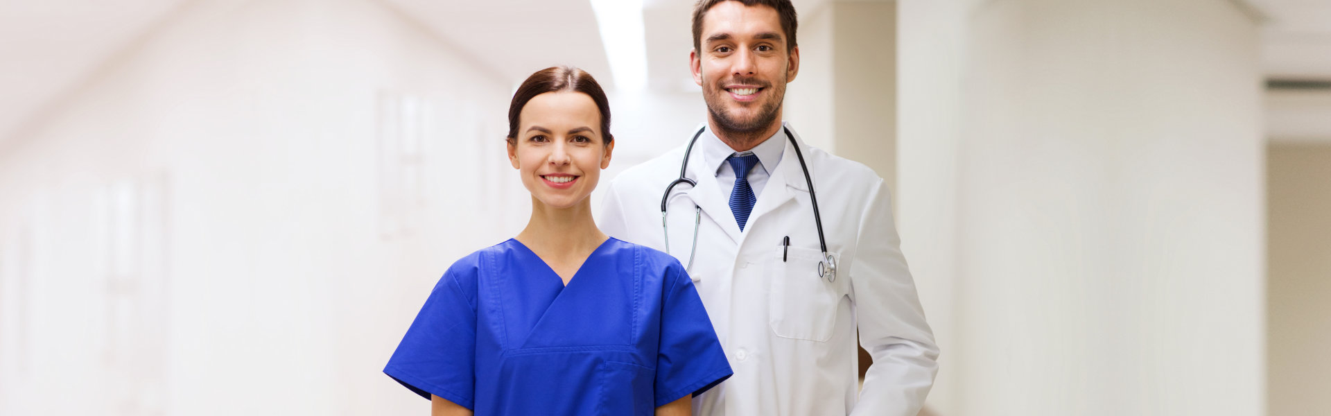 nurse and doctor smiling